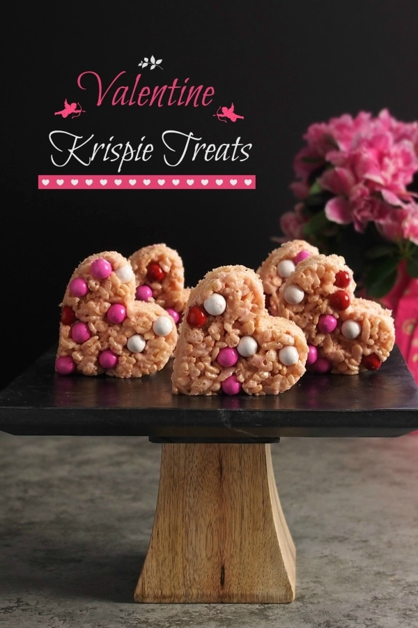 Valentine Krispie Treats made easy using strawberry heart marshmallows, garnished with your favorite candy and cut out with Valentine shaped cookie cutters. Simply Sated