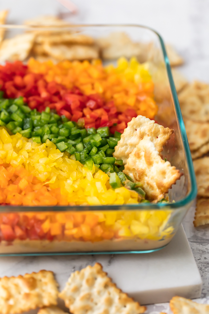 Rainbow Pepper Hummus Dip is tasty and gorgeous. It's also described with a 7-letter word...HEALTHY! It's a dip veggie-lovers love! It's a dip veggie-haters love! It's a dip children love, and it's a dip that will make you adored by the masses. So, join the Rainbow Pepper Hummus Dip party and you will be loved by all. Simply Sated