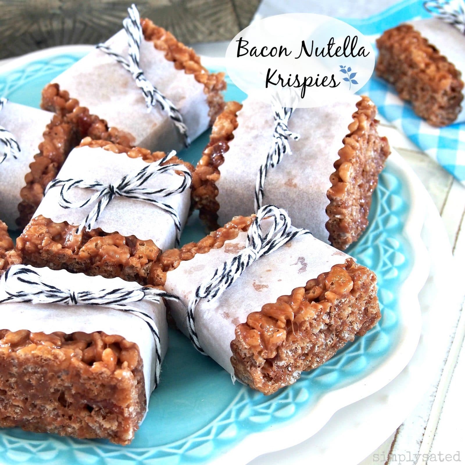 Bacon Nutella Krispies - krispie treats pumped up with the addition of chocolate hazelnut and bacon - a fun twist on a traditional dessert.