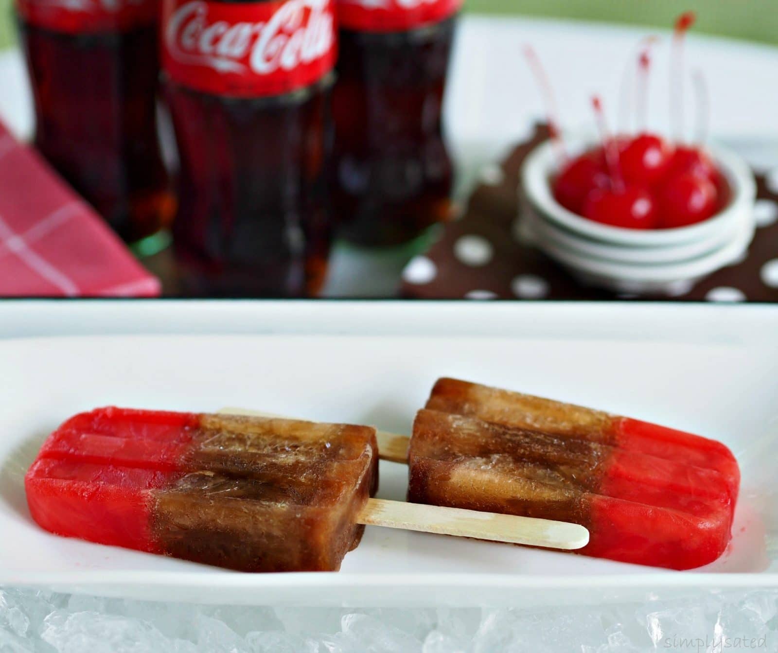 Cherry Coke Popsicles are a fun take on the real thing. www.simplysated.com