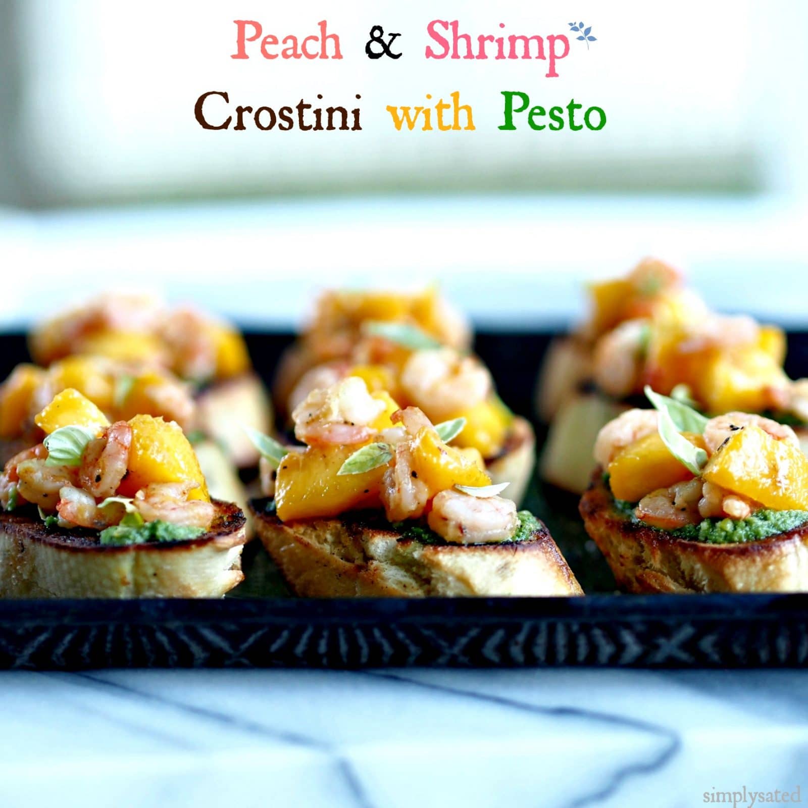 Peach & Shrimp Crostini with Pesto is an easy, elegant appetizer. Perfect for family or friends. www.simplysated.com
