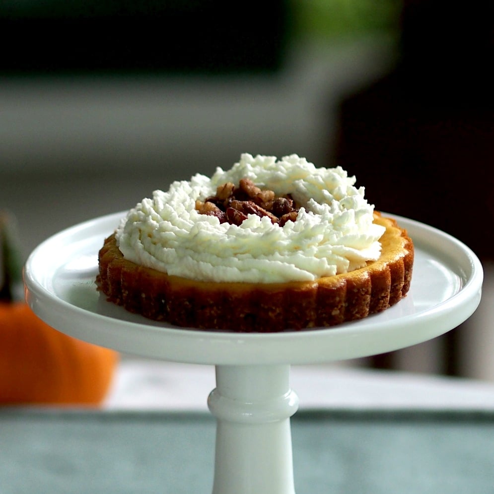 Pumpkin PIe Cheesecake - creamy pumpkin cheesecake topped with mascarpone whipped cream - YUM! simplysated