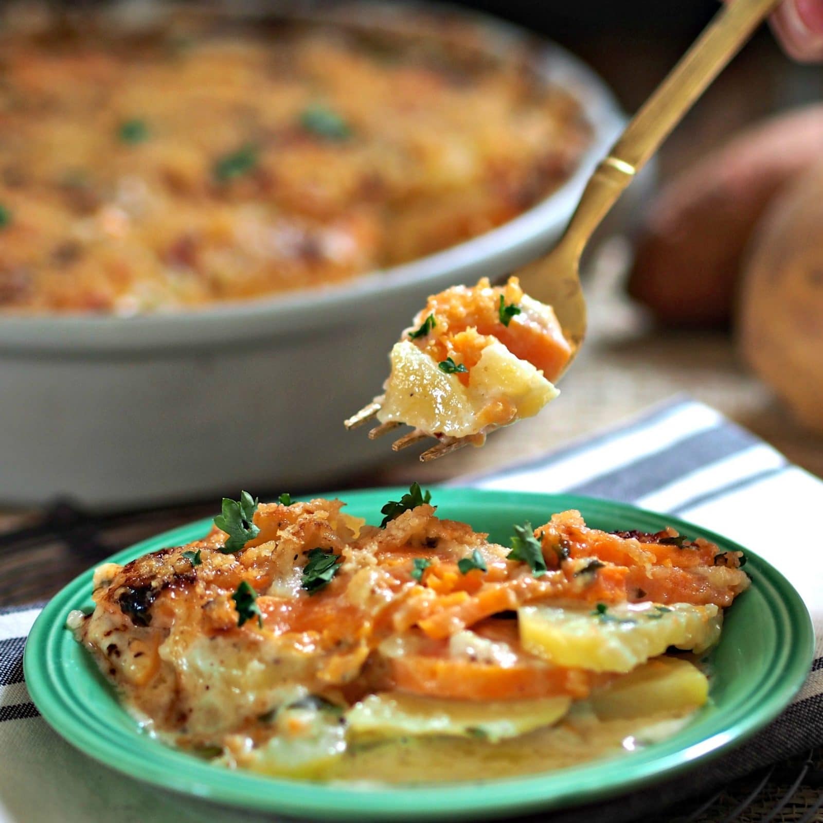 Two-Potato Gratin - Sweet potatoes, Yukon Golds & Gruyere cheese come together to create this delectable dish. Simply Sated