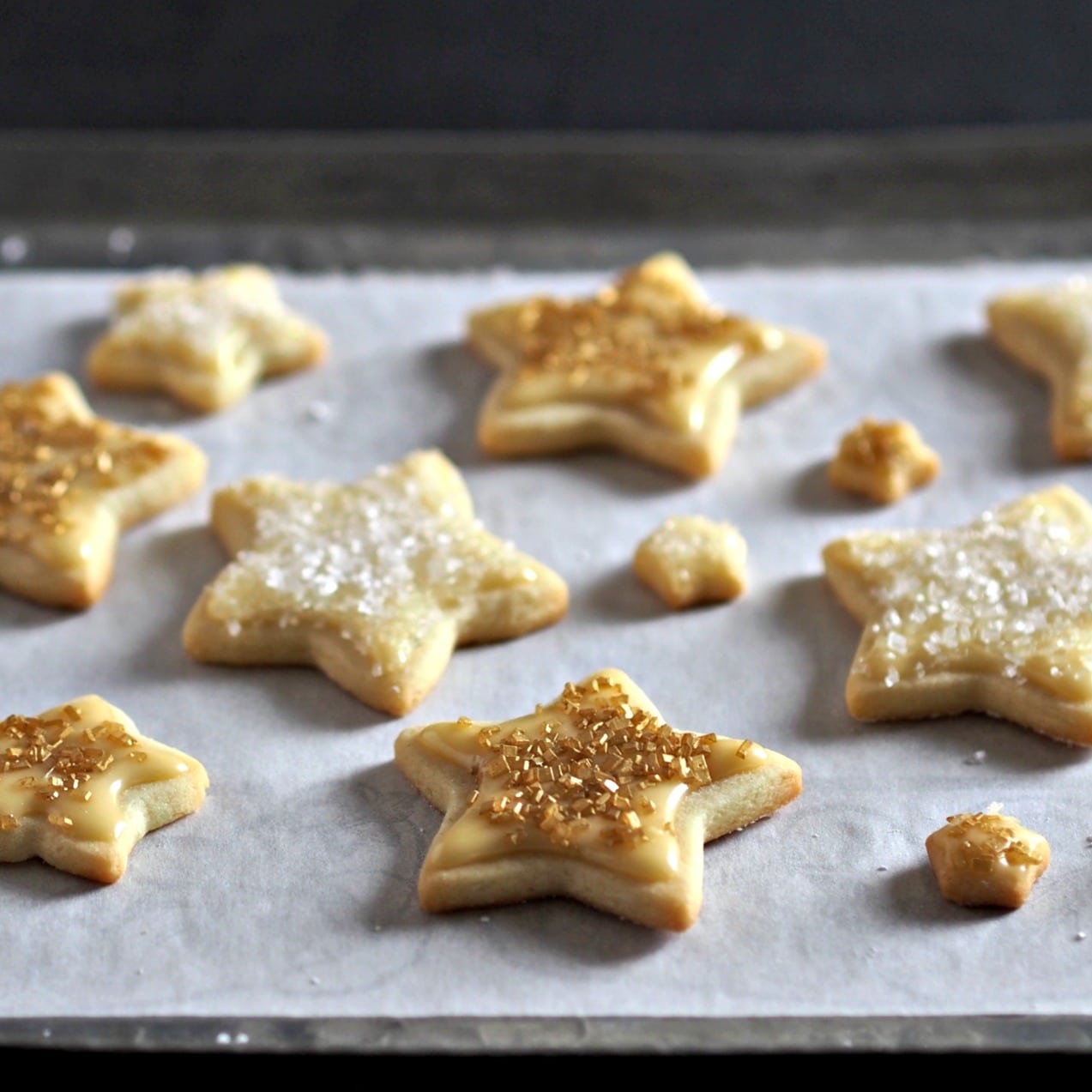 Gold Star Iced Cookies are a cookie deserving of a gold star. Tender inside & slightly crispy outside. Topped w/a simple corn syrup glaze & sanding sugar. Simply Sated
