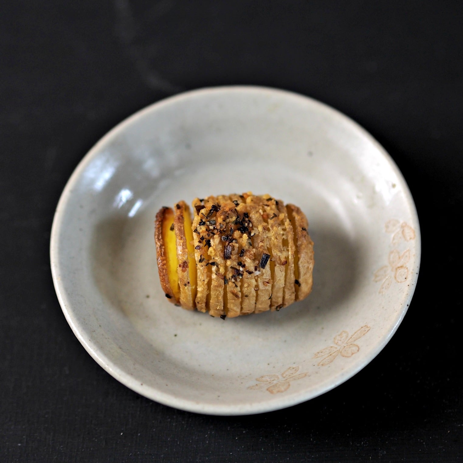 Baby Hasselback Potatoes - the perfect side for a family meal or formal dinner party. Accordion-sliced baby gold potatoes fan open while baking. Simply Sated