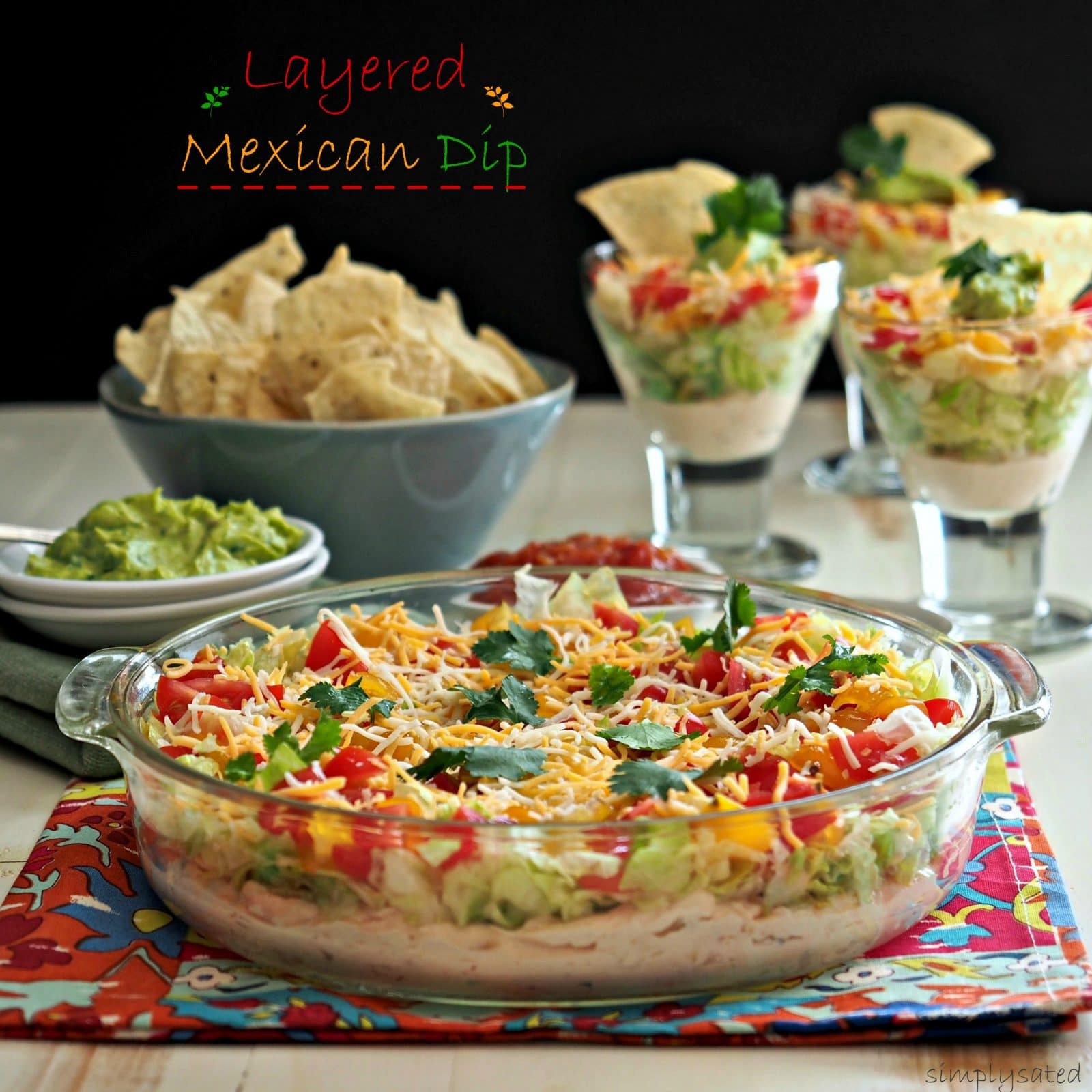 Layered Mexican Dip is as cozy as a patchwork quilt. It is an all-time favorite in its simplest form. Cream cheese, salsa, cheese, lettuce & tomatoes. Simply Sated