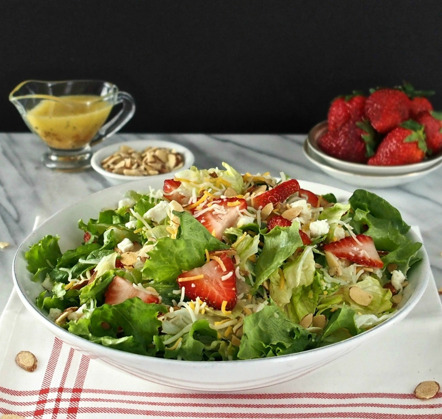 Strawberries & Greens Salad has stood the test of time. Strawberries, greens, sugared almonds, cheese with poppy seed sweet & sour dressing & croutons. Simply Sated