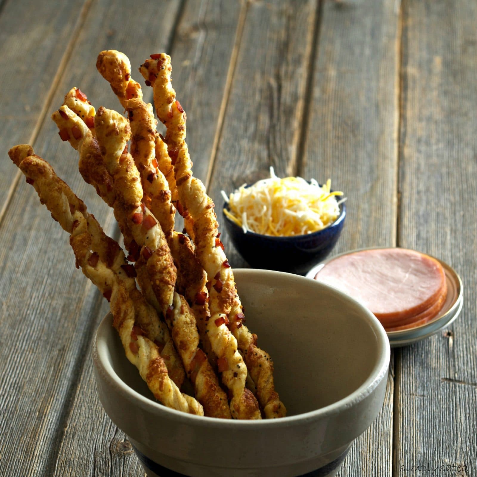 Canadian Bacon Cheese Straws-easy to make, elegant and delicious -the first appetizer to disappear at any dinner party. A great "bread" with a salad. Simply Sated