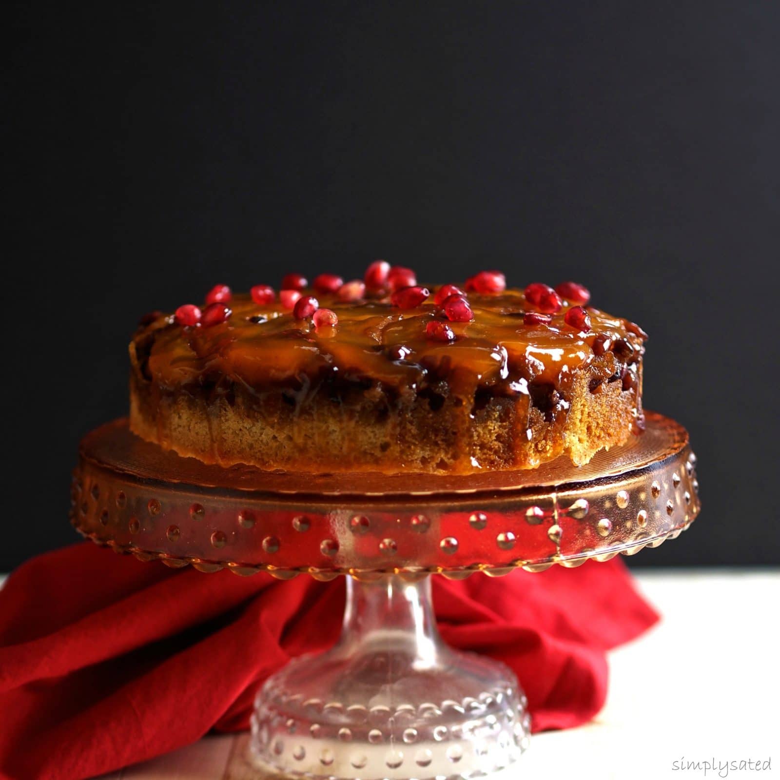 Pomegranate Pear Upside-Down Cake - versatile, delicious cake to make with most seasonal fruits & served with or without ice cream. The star of the show. Simply Sated