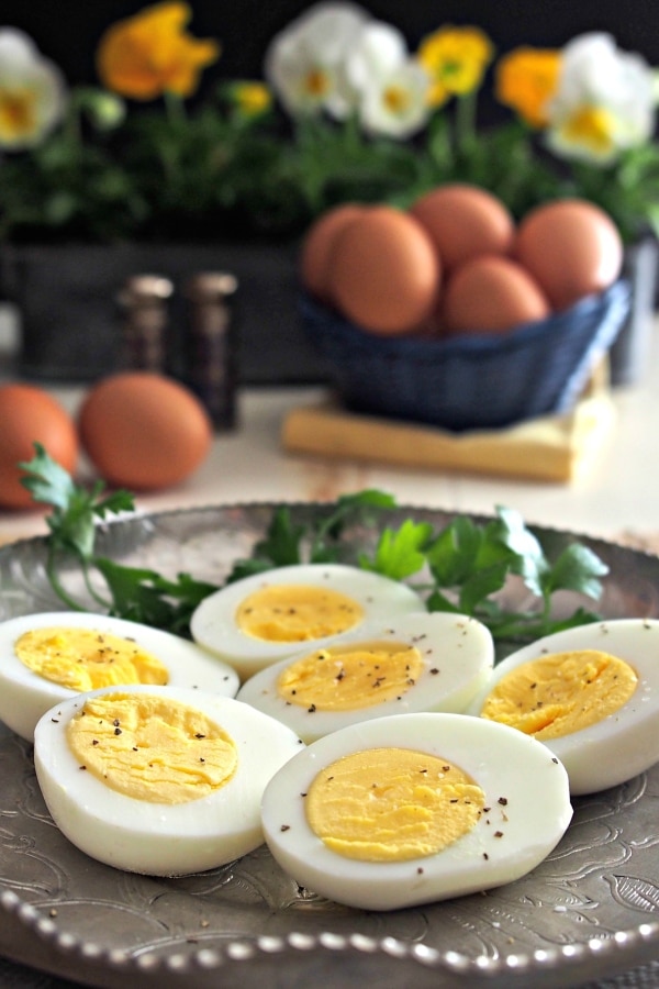 Hard-Cooked Steamed Eggs. Steaming eggs instead of boiling them creates eggs with yellow yolks, perfect whites & eggs easier to peel. Egg perfection. Simply Sated