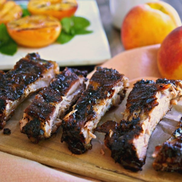 Peach Bourbon Baby Back Ribs. The BEST RIBS EVER!! Perfectly seasoned, fall-off-the-bone, tender ribs baked then grilled with peach bourbon barbecue sauce. Simply Sated