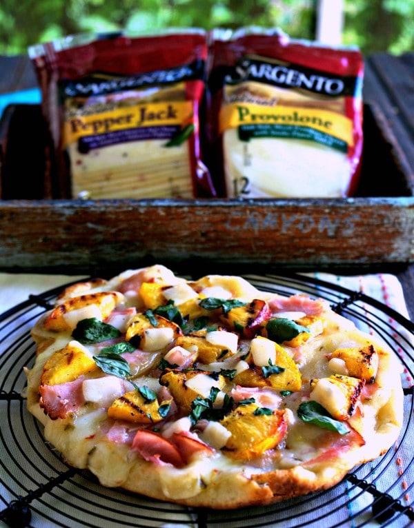 Grilled Peach & Pepper Jack Pizza (EASY) flatbread topped with Sargento Pepper Jack & Provolone Cheese slices, grilled peaches, deli ham, basil & honey. Simply Sated