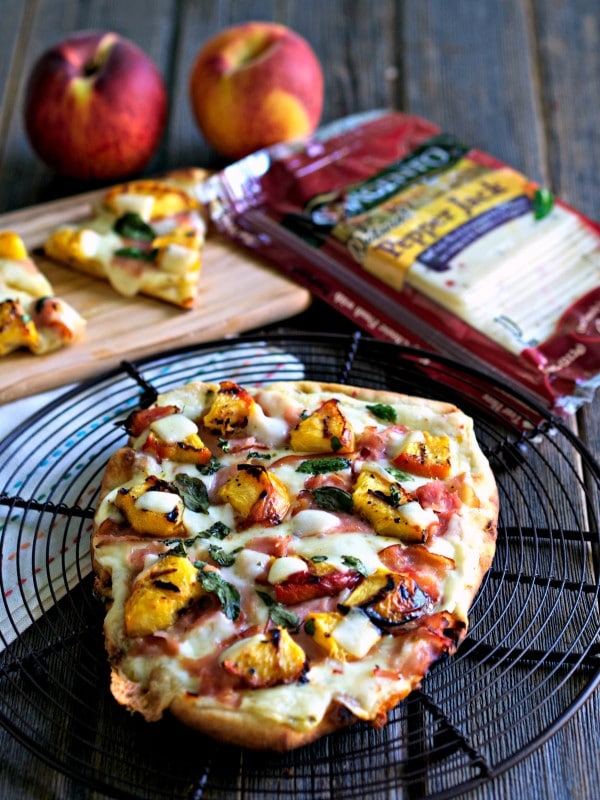 Grilled Peach & Pepper Jack Pizza (EASY) flatbread topped with Sargento Pepper Jack & Provolone Cheese slices, grilled peaches, deli ham, basil & honey. Simply Sated