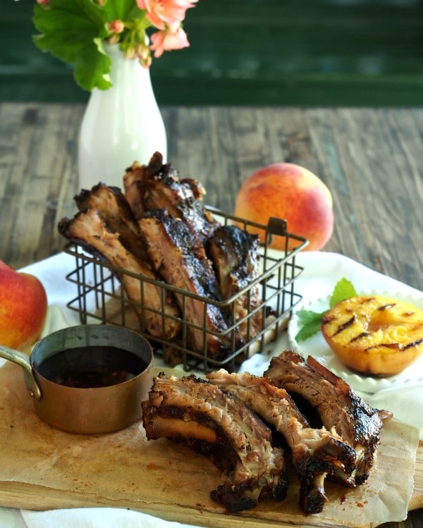 Peach Bourbon Baby Back Ribs. The BEST RIBS EVER!! Perfectly seasoned, fall-off-the-bone, tender ribs baked then grilled with peach bourbon barbecue sauce. Simply Sated