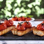 Roasted Tomato Bruschetta. Toasted Italian bread topped w/roasted tomatoes on the vine - the perfect appetizer for your favorite Italian meal. Simply Sated