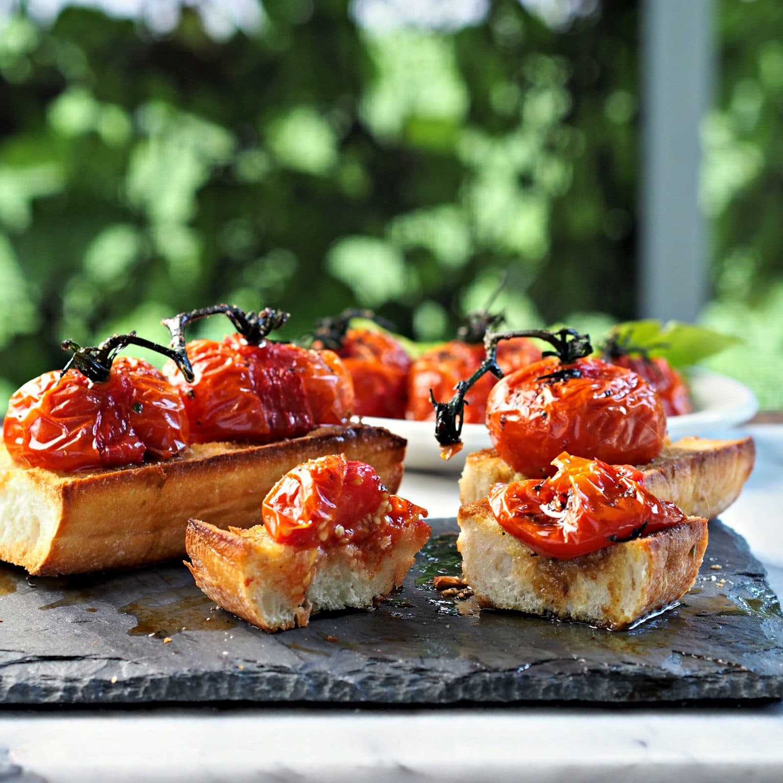 Roasted Tomato Bruschetta. Toasted Italian bread topped w/roasted tomatoes on the vine - the perfect appetizer for your favorite Italian meal. Simply Sated