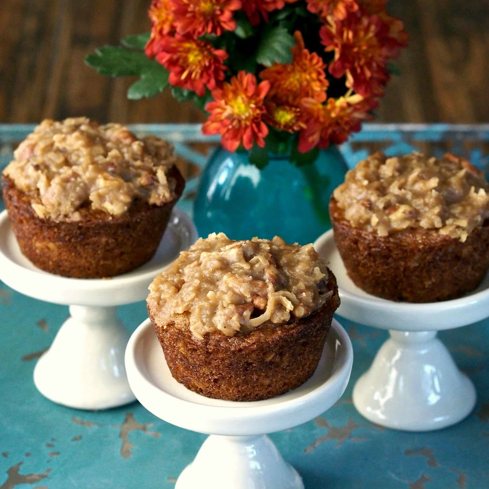 Old-Fashioned Oatmeal Cake & Cupcakes with Coconut Pecan Frosting. Moist, fall-spiced cake packed with flavor & topped, while warm, with perfect frosting. Simply Sated