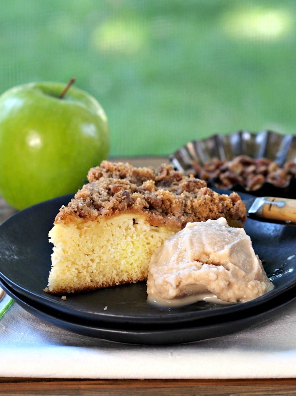 Apple Streusel Cake. Tender cake baked with sliced fresh apples & topped with a cinnamon, pecan, brown sugar streusel. Perfect as a dessert or coffee cake. Simply Sated