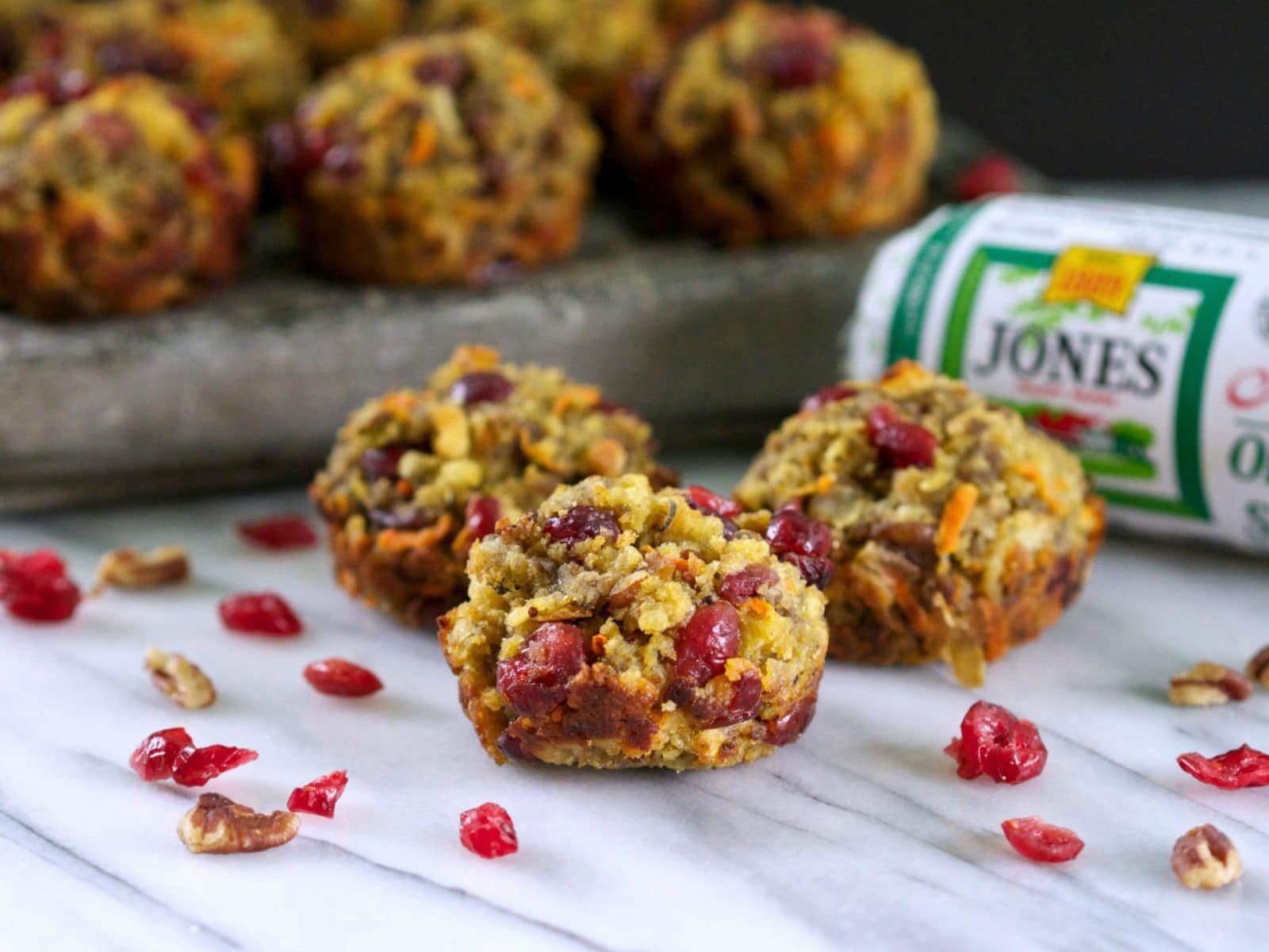 Cranberry and Cornbread Stuffing Muffins with Jones Sausage. Cornbread stuffing mixed with sausage, dried cranberries, shredded carrots & toasted pecans. Simply Sated