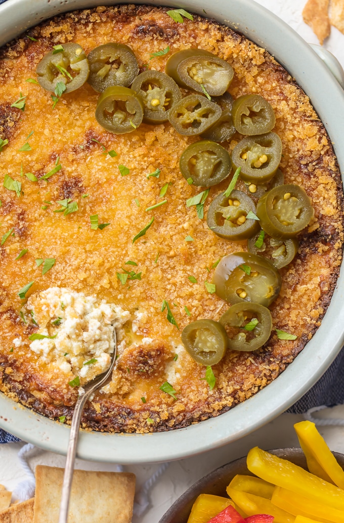 Jalapeno Popper Dip is everything you love about jalapeno poppers. Jalapenos, chilies & cheese melted together with a crunchy panko topping. Simply Sated