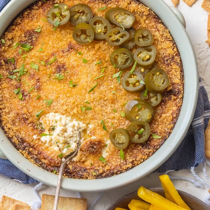 Jalapeno Popper Dip is everything you love about jalapeno poppers. Jalapenos, chilies & cheese melted together with a crunchy panko topping. Simply Sated