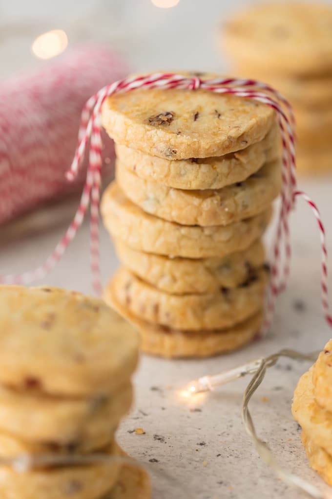 Cranberry Orange Almond Shortbread Cookies. Cranberries, oange zest, honey almonds all rolled up in an easy shortbread cookie dough. A perfect sweet treat. Simply Sated