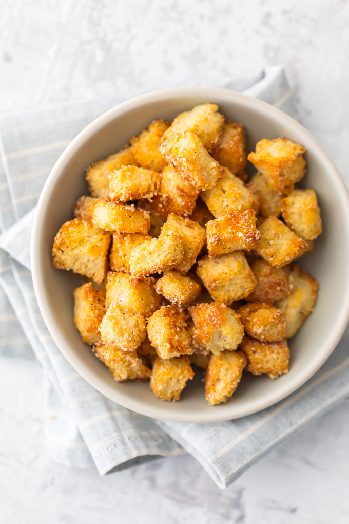 If you want homemade croutons in your life (and you do), Homemade Garlic Parmesan Croutons are THE choice. They are crispy, yet tender, with a hint of garlic and the perfect amount of Parmesan. They aren't only great on salad, they make a terrific snack. Simply Sated