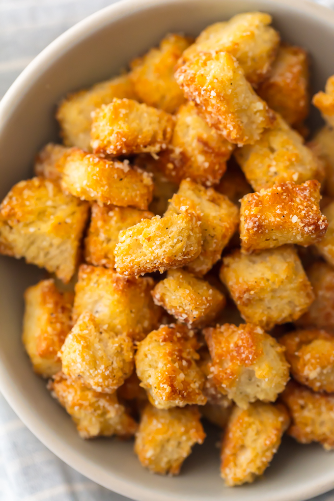 If you want homemade croutons in your life (and you do), Homemade Garlic Parmesan Croutons are THE choice. They are crispy, yet tender, with a hint of garlic and the perfect amount of Parmesan. They aren't only great on salad, they make a terrific snack. Simply Sated